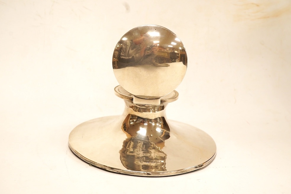 A George V silver mounted capstan inkwell, maker's mark rubbed, Birmingham, 1911, with later plastic well, base diameter 17.7cm. Condition - fair